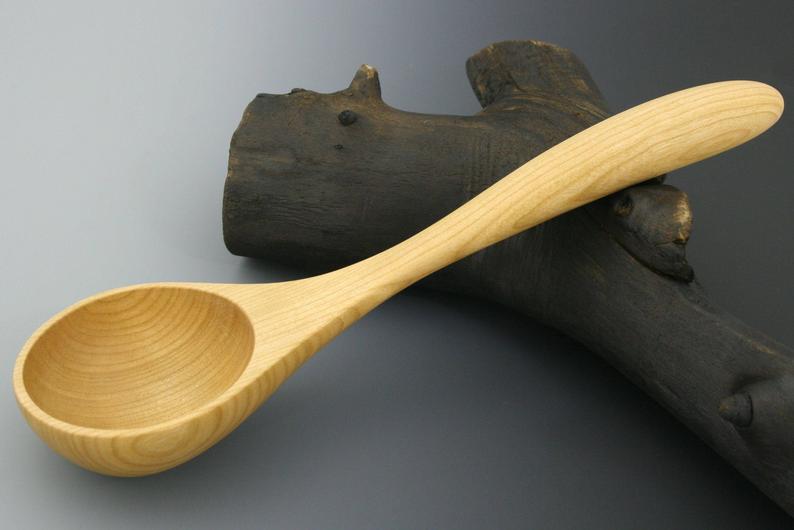 Small serving ladle in cherry wood.