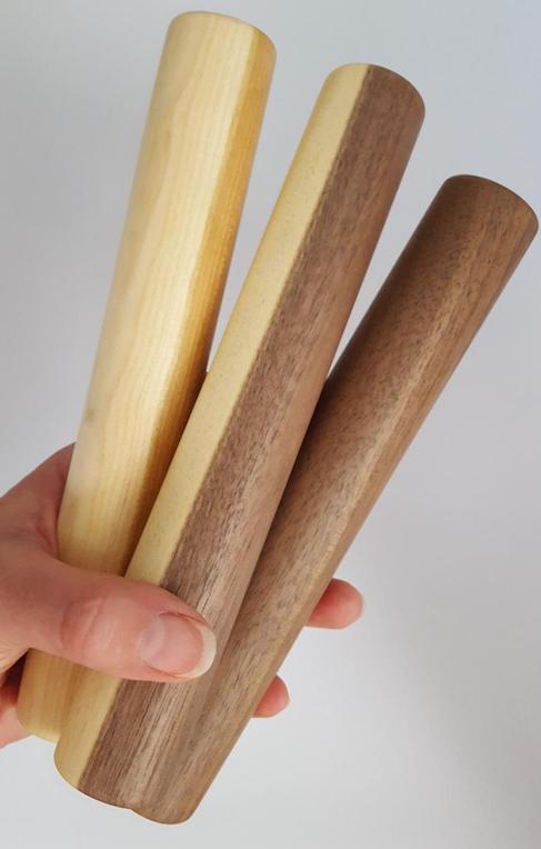 Small wood turned rolling pins in cherry and walnut wood.