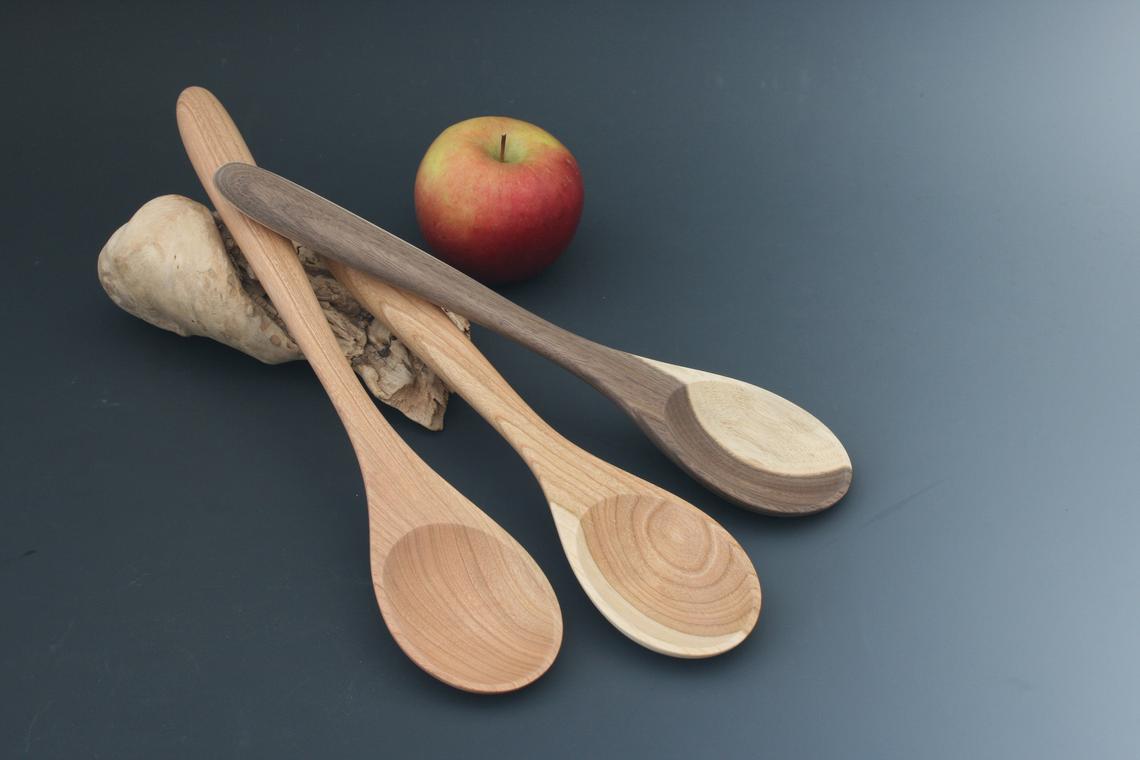 Spoons handcrafted from cherry and walnut hardwoods in various lengths.