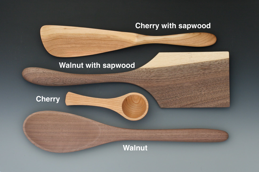 Handmade wood utensils annotated with and without sapwood accent.