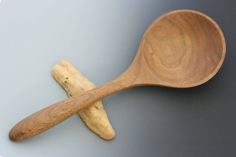 Walnut wood large and shallow serving spoon.